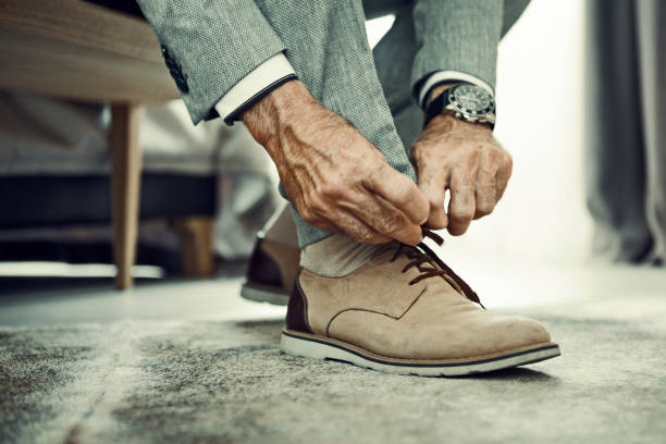 istock Tying shoelaces in hotel room 1184710289