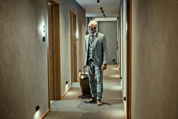 istock Senior businessman in hotel 1184710330