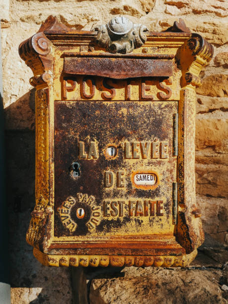 istock Antique yellow french mailbox. 1184712855