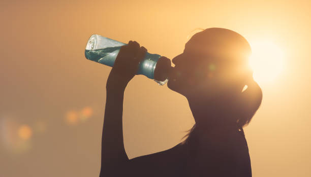 istock Woman drinking water 1184718514