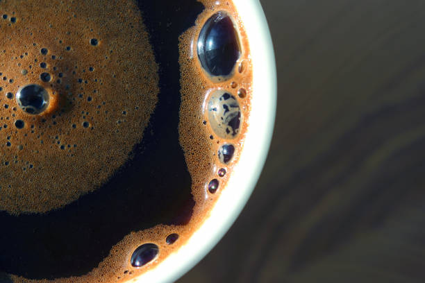 istock freshly brewed black coffee in a white cup in the sunlight. 1184719065