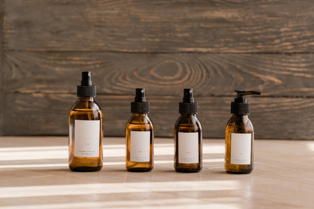 istock Cosmetic dark amber bottles on wooden  table 1184723211