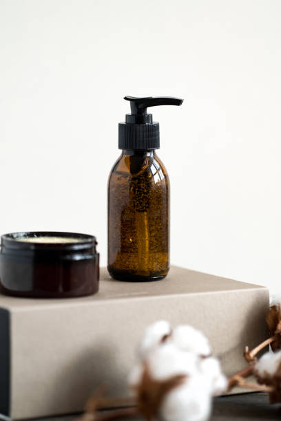 istock Brown glass cosmetic bottle and jar against white 1184723788