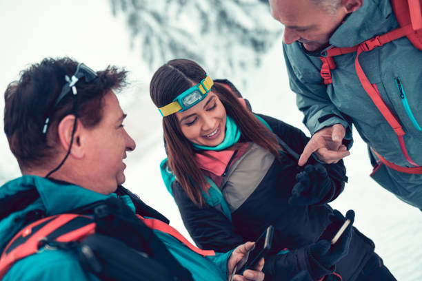 istock Snow Hikers Deciding Their Direction Of Travel 1184724844
