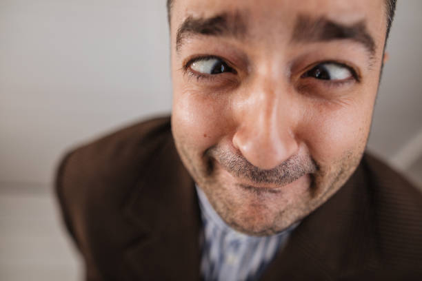 Childish businessman making faces