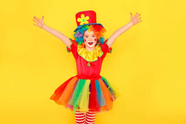 Photo of Cheers, victory! Beautiful little girl in carnival costume celebration win