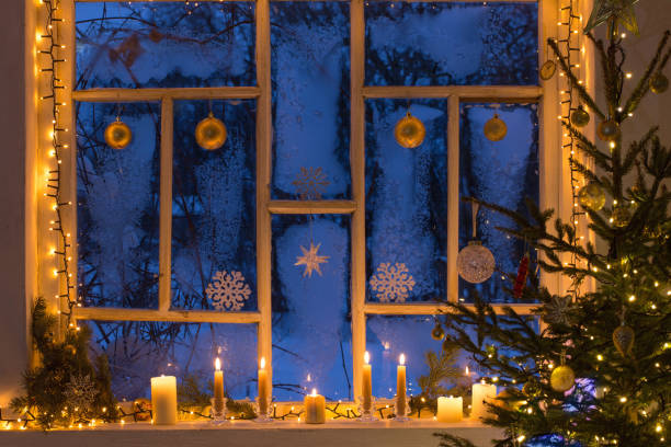 istock Christmas decorations on old wooden window 1184729992