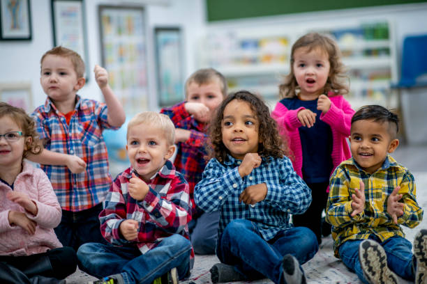 multi-ethnic preschool sing-along time stock photo - singing lesson photos et images de collection