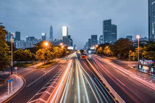istock traffic light through city at night in china 1184737393