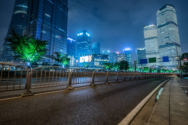 istock empty asphalt road with city skyline background in china 1184737437