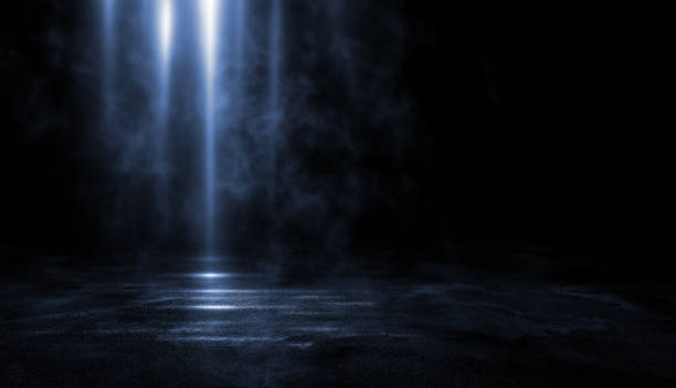 istock 3D rendering abstract dark empty scene, blue neon searchlight light, wet asphalt, smoke, night view, rays. Empty black studio room. Dark background. 1184739672