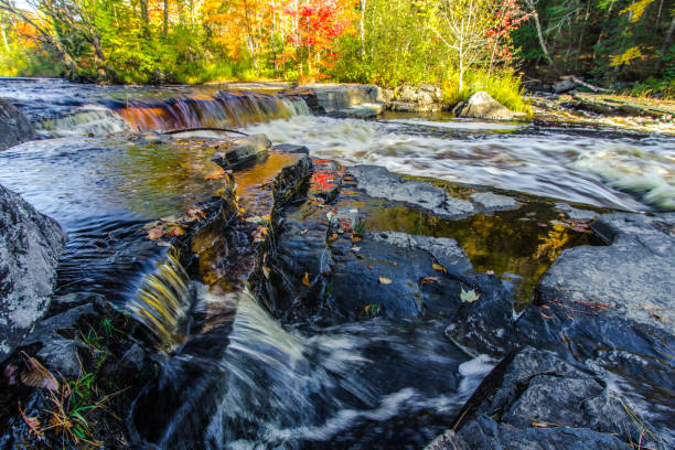 istock Michigan Upper Peninsula Waterfall In Autumn At Canyon Falls 1184747553