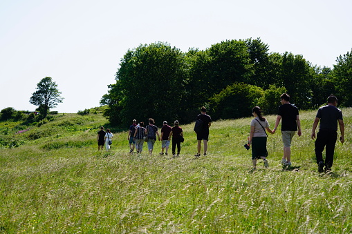 Brighton, East Sussex, England - 29 June 2019: Tourist talking a spectacular walk via a natural local tour to visit Devil's Dyke at country side in Brighton