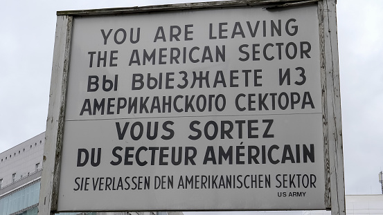 leaving the american sector sign at checkpoint charlie in berlin