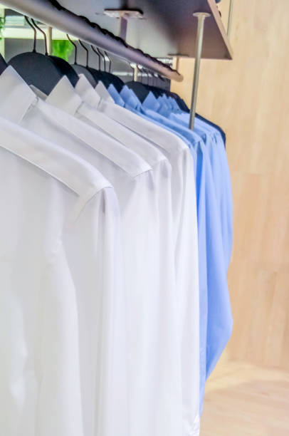 istock Row of different shirts hang in store 1184767853