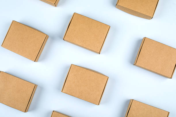 istock Paper boxes on light background. Top view, flat lay. Zero waste concept, eco gifts 1184768645