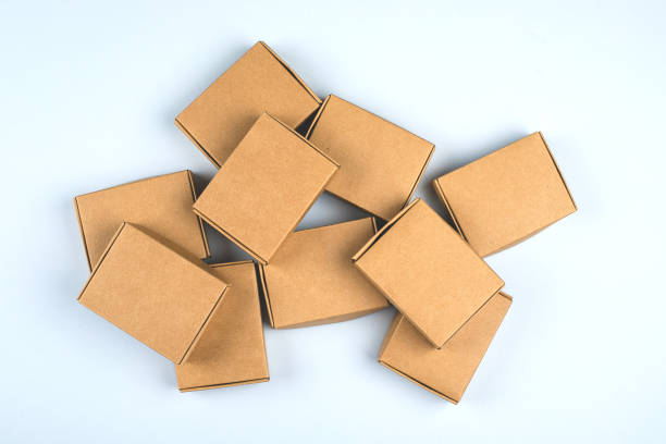istock Paper boxes on light background. Top view, flat lay. Zero waste concept, eco gifts 1184768909