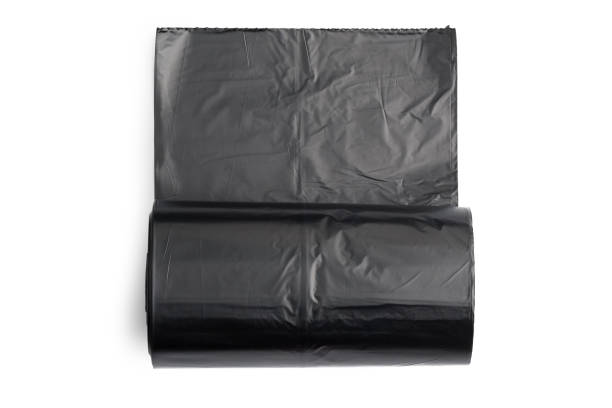 istock Black garbage bag on isolated white background with clipping path. 1184769246