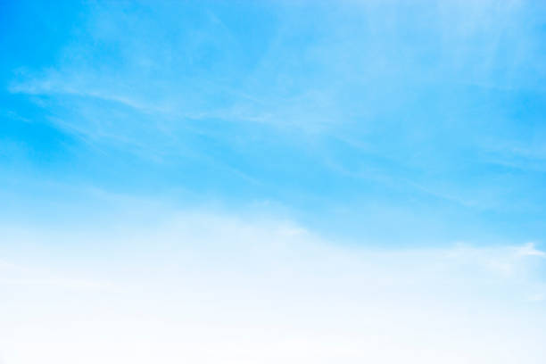 istock Blue sky background and white clouds soft focus, and copy space 1184774114