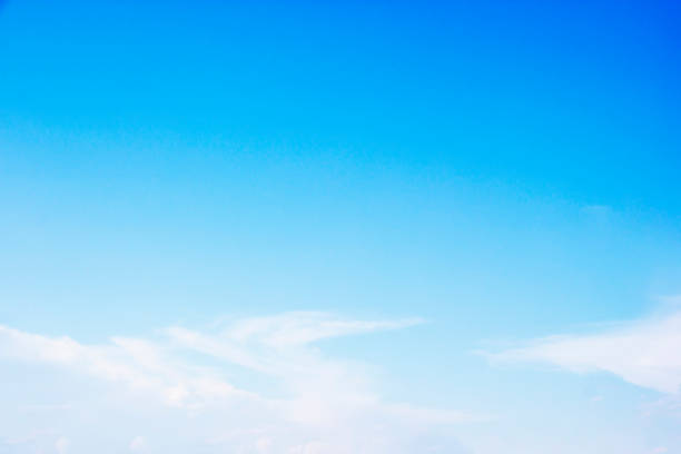istock Blue sky background and white clouds soft focus, and copy space 1184774260