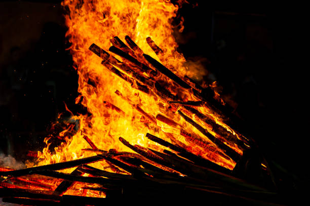 istock Bonfire that burns on a dark background, wood burning flame. 1184777756