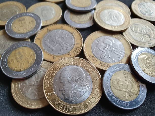 istock Mexican coins of different denominations unorganized 1184777757