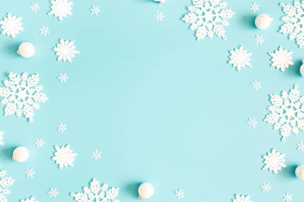 istock Christmas or winter composition. Pattern made of snowflakes on pastel blue background. Christmas, winter, new year concept. Flat lay, top view, copy space 1184779609