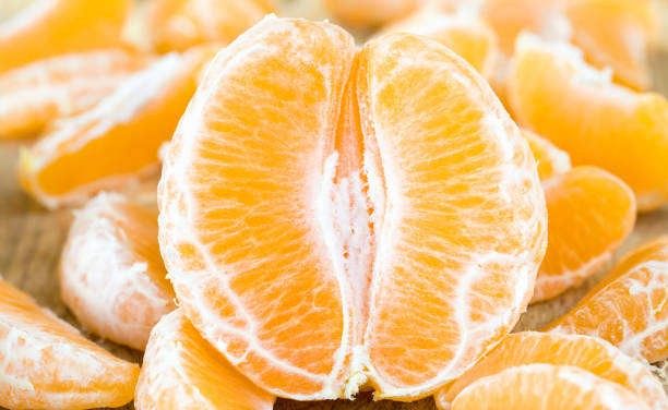 istock mandarin on a wooden board 1184780732