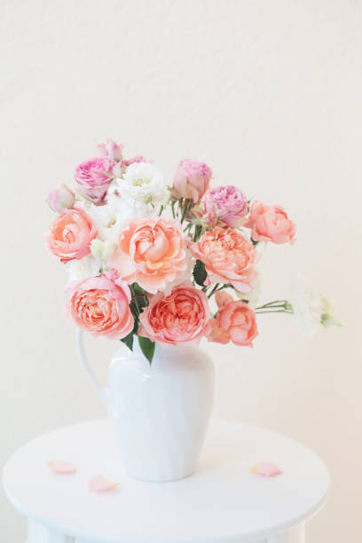 istock beautiful roses in ceramic white jug 1184781637