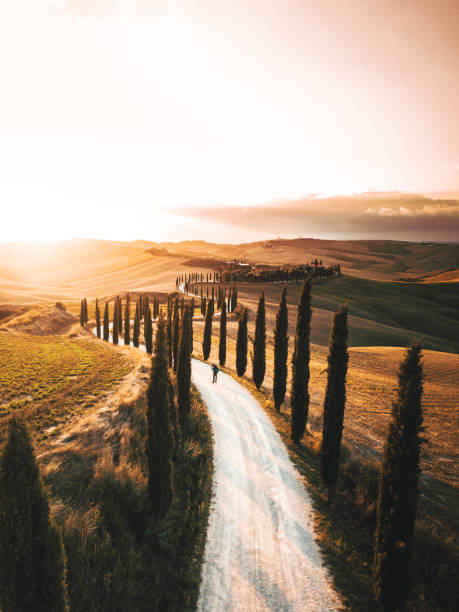 winding road in italy winding road in italy crete senesi stock pictures, royalty-free photos & images