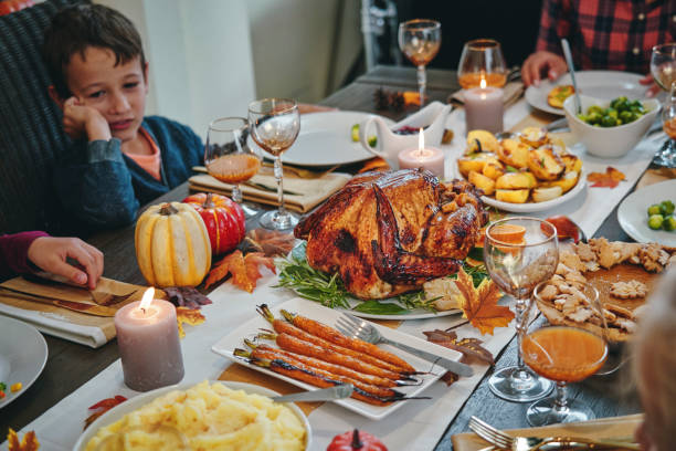 istock Family Having Traditional Holiday Stuffed Turkey Dinner 1184782949