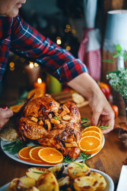 istock Roasting Stuffed Turkey in the Oven 1184782981