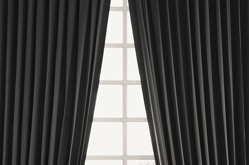 Black windows and curtains home interior natural sunlight background.