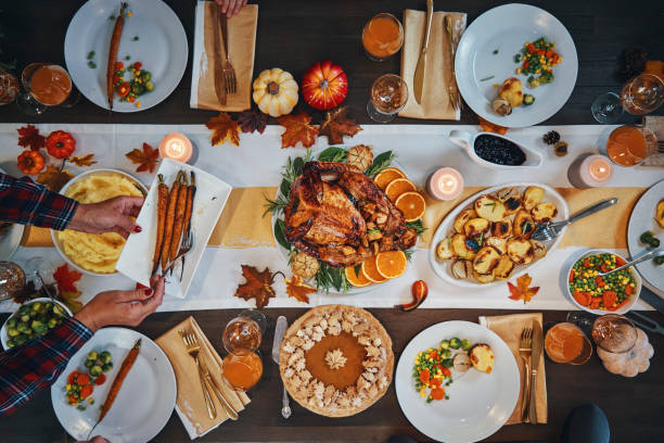 istock Family Having Traditional Holiday Stuffed Turkey Dinner 1184783864