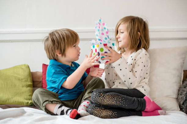 istock Brother sister gift 1184785138