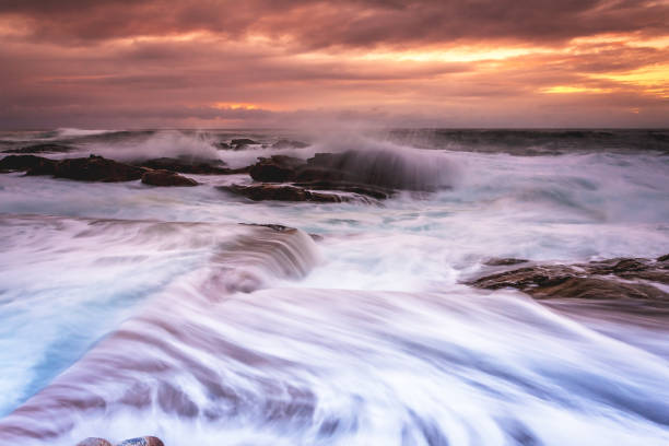 istock Large swell tidal overflows in Blue Pool Bermagui 1184788268