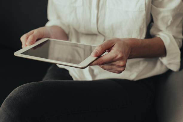 istock A picture of a young woman working on a tablet computer 1184788335