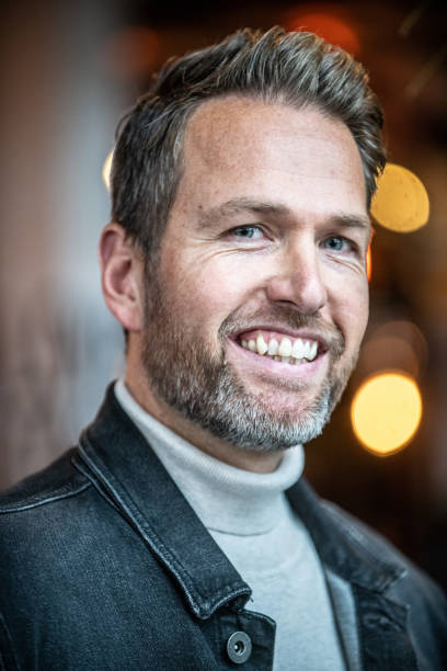 istock 40 year old male smiling at the camera 1184788456