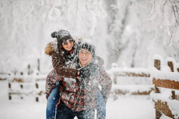istock Happy couple having fun on snow 1184789429