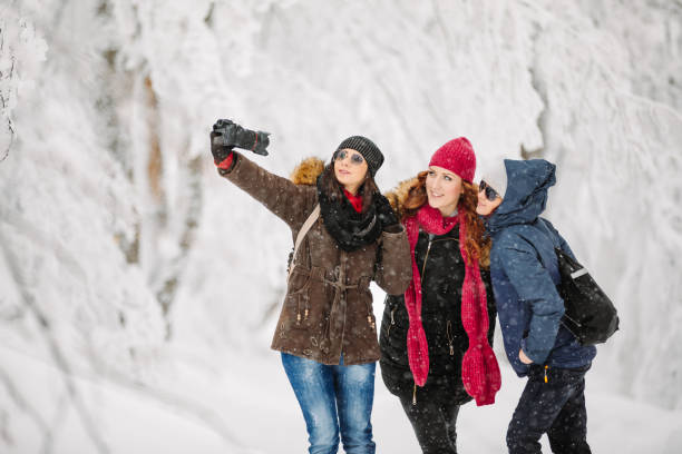 istock Friends taking selfie on snow 1184789669
