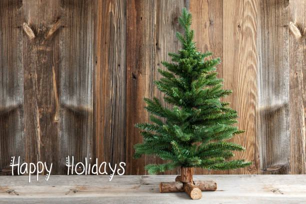 istock Christmas Tree, Calligraphy Happy Holidays, Wooden Background 1184792023
