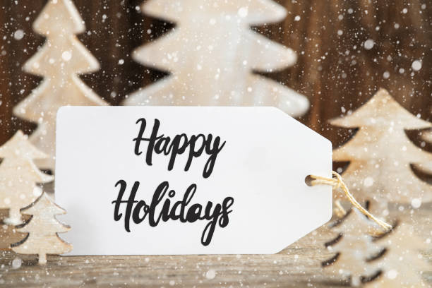 istock White Christmas Tree, Label With English Text Happy Holidays, Snowflakes 1184793247