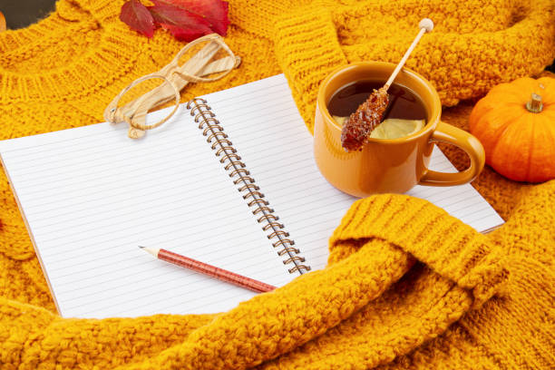 istock Flat lay autumn composition with tea and a warm woolen sweater 1184793484