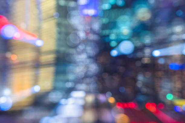 istock Blurred skyscrapers by night with lights trail 1184795112