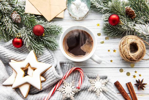 istock Cup of coffee and Christmas decorations 1184802728