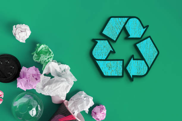 istock symbol or icon of recycling, top view flat lay with some garbage 1184804524