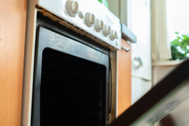 opening the gas oven in the kitchen while baking and cooking