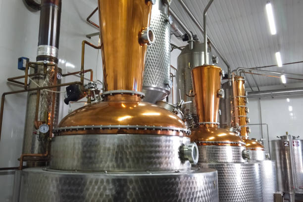 Installation for preparation of brandy and alcohol from fruits. Alcohol factory and its equipment. stock photo