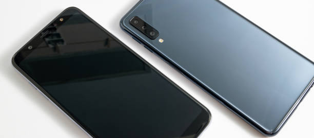 istock Smartphones on white background view from top. Mobile technology concept. Modern design. 1184808873