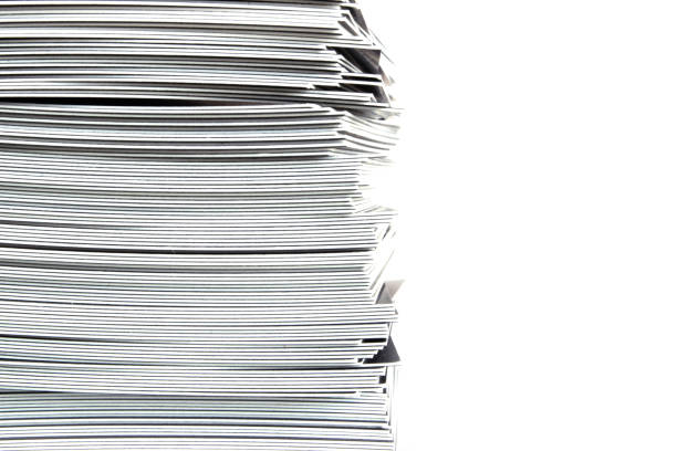 istock Stack of paper business cards close up on white background. Copy space. 1184808897